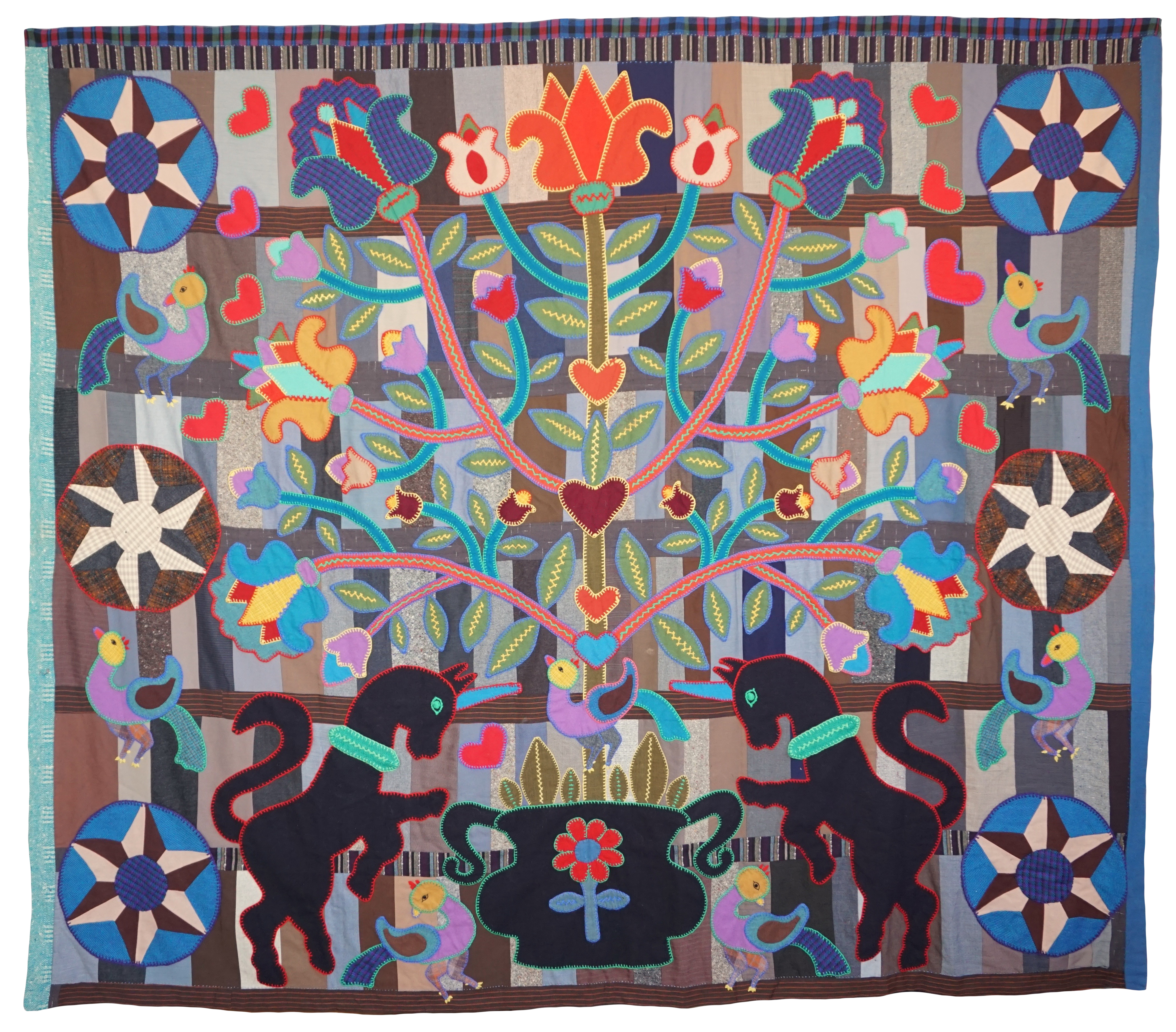 Penn Dutch Tulip Tree of Life Quilt, c. 1965, on stacked wool bars